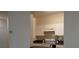 Clean kitchen featuring white cabinets and appliances, with a pass-through to the living space at 581 Brantley Terrace Way # 302, Altamonte Springs, FL 32714