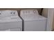 A laundry room with a side-by-side white washer and dryer at 581 Brantley Terrace Way # 302, Altamonte Springs, FL 32714