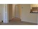 Bright living room with neutral carpet and paint leads to a kitchen and bedrooms at 581 Brantley Terrace Way # 302, Altamonte Springs, FL 32714