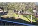 Relaxing view from the screened patio, featuring mature trees and well-maintained landscaping at 581 Brantley Terrace Way # 302, Altamonte Springs, FL 32714