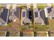 Aerial view of the home and backyard and solar panels on roof at 6984 Dilly Lake Ave, Groveland, FL 34736
