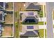 Aerial view of multiple roofs, some featuring solar panels, within a neighborhood at 6984 Dilly Lake Ave, Groveland, FL 34736
