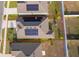 Aerial view of the home with solar panels and outlining the backyard at 6984 Dilly Lake Ave, Groveland, FL 34736