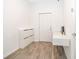 Clean and modern entryway with light wood flooring and minimalist decor at 6984 Dilly Lake Ave, Groveland, FL 34736