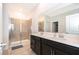 Elegant bathroom featuring a double sink vanity and glass enclosed shower at 6984 Dilly Lake Ave, Groveland, FL 34736