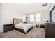 Serene bedroom with neutral decor, carpet flooring and a large window for natural light at 6984 Dilly Lake Ave, Groveland, FL 34736