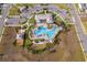 Aerial image of community pool, water park, and ample lounging space at 6984 Dilly Lake Ave, Groveland, FL 34736