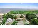 Aerial view of a property near a lake with a green and blue landscape background at 701 Lakeshore Blvd, St Cloud, FL 34769