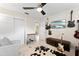 Relaxing bedroom features mounted guitars, mounted TV, and cozy seating area at 701 Lakeshore Blvd, St Cloud, FL 34769