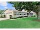 Single-story home featuring a manicured lawn, attached garage, and charming curb appeal at 701 Lakeshore Blvd, St Cloud, FL 34769