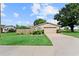 Charming single-story home featuring a two-car garage and a well-manicured front lawn at 701 Lakeshore Blvd, St Cloud, FL 34769