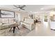 Bright and open living room featuring neutral tones, recessed lighting, and a ceiling fan at 701 Lakeshore Blvd, St Cloud, FL 34769