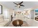 Spacious living room with contemporary furnishings, neutral walls, and a ceiling fan at 701 Lakeshore Blvd, St Cloud, FL 34769