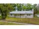 Charming single-story home featuring a fenced yard and a sidewalk at 715 Ballard St, Altamonte Springs, FL 32701