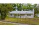 Charming single-story home featuring a fenced yard and a sidewalk at 715 Ballard St, Altamonte Springs, FL 32701