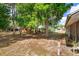 Spacious backyard featuring a large tree that offers shade and privacy at 718 Wildwood Dr, Winter Springs, FL 32708