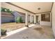 Open carport with concrete flooring and support columns, providing covered parking and access to the home's entrance at 718 Wildwood Dr, Winter Springs, FL 32708