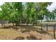 Community park with benches under shade trees and fenced perimeters for a secure play environment at 718 Wildwood Dr, Winter Springs, FL 32708
