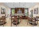 Spacious clubhouse with a modern kitchen, ample seating, and stylish decor at 7573 Laureate Blvd # 1-404, Orlando, FL 32827