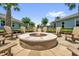 Cozy outdoor fire pit area with comfortable seating at 7573 Laureate Blvd # 1-404, Orlando, FL 32827