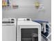 Well-equipped laundry room with modern washer and dryer at 7573 Laureate Blvd # 1-404, Orlando, FL 32827