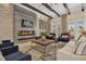 Relaxing lounge area featuring cozy seating, modern fireplace, and decorative lighting at 7573 Laureate Blvd # 1-404, Orlando, FL 32827