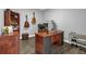 Office room with wood desk, hardwood floors, neutral color palette, and natural light at 7573 Laureate Blvd # 1-404, Orlando, FL 32827