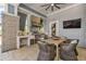 Stylish outdoor kitchen featuring a grill, dining area, and outdoor television at 7573 Laureate Blvd # 1-404, Orlando, FL 32827