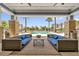Inviting poolside lounge area with comfortable seating and serene pool views at 7573 Laureate Blvd # 1-404, Orlando, FL 32827