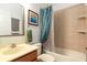 Bathroom features a bathtub and a shower with patterned curtains at 804 Challis Pt, Longwood, FL 32779