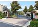 Gated entrance to a community with manicured landscaping and brick accents at 804 Challis Pt, Longwood, FL 32779