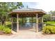 Beautiful gazebo overlooking a pond with a fountain, perfect for relaxation at 804 Challis Pt, Longwood, FL 32779