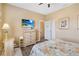 Cozy bedroom featuring a comfortable bed, ceiling fan, soft lighting, and stylish furnishings at 822 Brunello Dr, Davenport, FL 33897