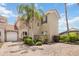 Charming two-story home with a red tile roof, paver driveway, and well-maintained landscaping at 822 Brunello Dr, Davenport, FL 33897