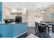 Open kitchen with modern appliances, a breakfast bar, and a dining area for casual meals at 822 Brunello Dr, Davenport, FL 33897