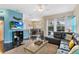 Inviting living room with a comfortable black leather sectional and pool views at 822 Brunello Dr, Davenport, FL 33897