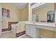 Bathroom featuring a large bathtub with decorative wallpaper and a vanity with white cabinets and a makeup counter at 842 Amidon St, Deltona, FL 32725