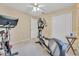 Bedroom featuring carpeting and exercise equipment and a ceiling fan at 842 Amidon St, Deltona, FL 32725
