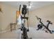 Bedroom featuring carpeting and exercise equipment, including an elliptical and exercise bike at 842 Amidon St, Deltona, FL 32725