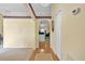 Inviting foyer with hardwood flooring, neutral walls, and an archway leading to the living spaces at 842 Amidon St, Deltona, FL 32725