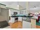 Bright kitchen features stainless steel appliances, granite countertops, and white cabinetry at 842 Amidon St, Deltona, FL 32725