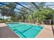 Inviting pool with a screened enclosure surrounded by lush landscaping, perfect for outdoor enjoyment at 842 Amidon St, Deltona, FL 32725