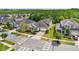 Aesthetic aerial view of the home in a peaceful suburban neighborhood surrounded by lush greenery at 8420 Corkfield Ave, Orlando, FL 32832