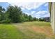 Large, well-maintained backyard with mature trees and a view of the surrounding landscape at 8420 Corkfield Ave, Orlando, FL 32832