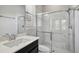Updated bathroom features a glass door shower and stylish vanity at 8420 Corkfield Ave, Orlando, FL 32832
