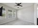 Bright bedroom with a ceiling fan, carpeted floors and lots of natural light at 8420 Corkfield Ave, Orlando, FL 32832