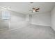 Spacious bonus room featuring neutral walls, carpet flooring, and a ceiling fan at 8420 Corkfield Ave, Orlando, FL 32832