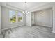Bright dining room features natural light and wood look floors at 8420 Corkfield Ave, Orlando, FL 32832