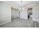 Open floor plan showcasing bright dining room with wood look flooring at 8420 Corkfield Ave, Orlando, FL 32832