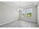 Bright dining room filled with natural light and wood look floors at 8420 Corkfield Ave, Orlando, FL 32832